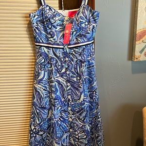 New Lily blue floral dress size 8. Strappy, with pockets.